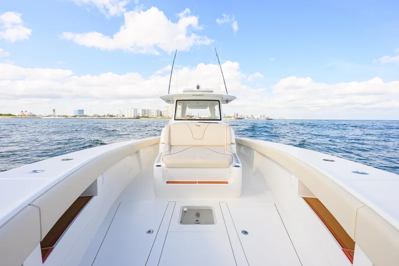 Slide: The Image of 2022 SeaVee 450Z boat on open water, showcasing spacious deck and seating. - 6