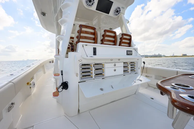 Slide: The Image of 2022 SeaVee 450Z boat interior with seating, storage, and ocean view. - 8