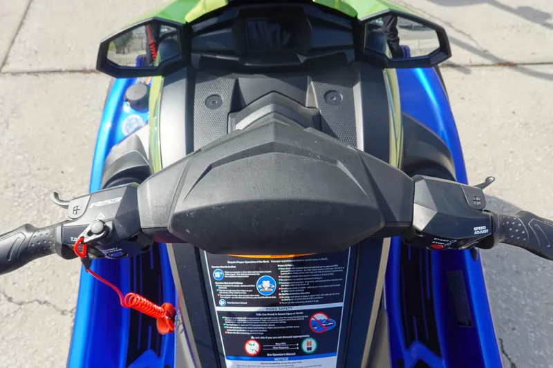 Slide: The Image of 2024 Yamaha WaveRunner VX Limited HO dashboard and controls, featuring vibrant blue and green design. - 12