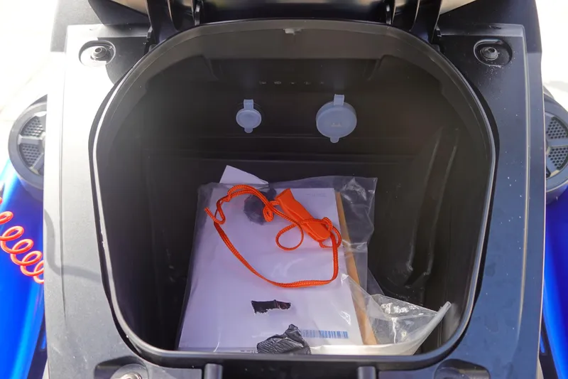 Slide: The Image of Storage compartment of 2024 Yamaha WaveRunner VX Limited HO with safety gear inside. - 13