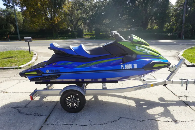 Slide: The Image of 2024 Yamaha WaveRunner VX Limited HO on trailer, vibrant blue and green design. - 4