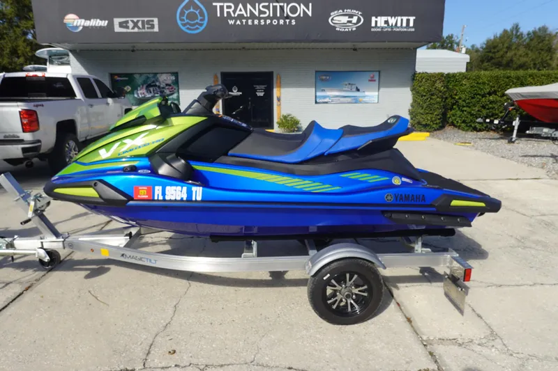 Slide: The Image of 2024 Yamaha WaveRunner VX Limited HO in vibrant blue and green on a trailer. - 5