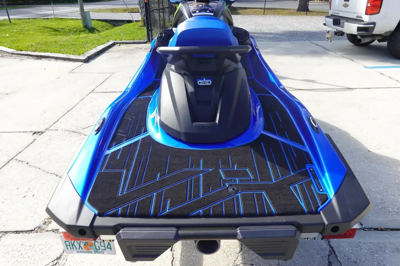 Slide: The Image of 2024 Yamaha WaveRunner VX Limited HO, blue, rear view on concrete surface. - 6
