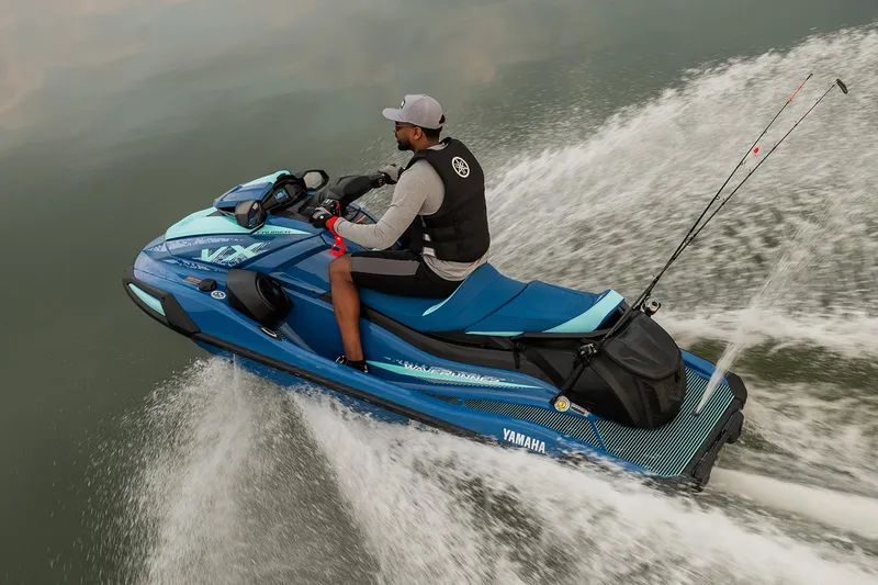 Slide: The Image of Manufacturer Provided Image: 2026 Yamaha WaveRunner VX Cruiser on water, rider in action, fishing rods attached. - 3