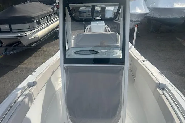 Slide: The Image of 2024 Sea Hunt Ultra 239 SE boat interior with console and seating. - 10