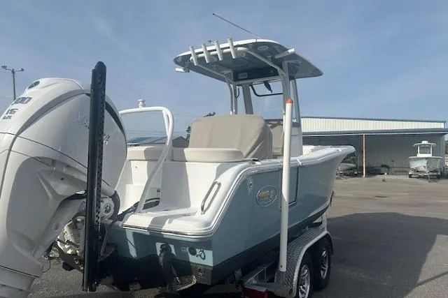 Slide: The Image of 2024 Sea Hunt Ultra 239 SE boat on trailer, featuring a sleek design and powerful engine. - 4