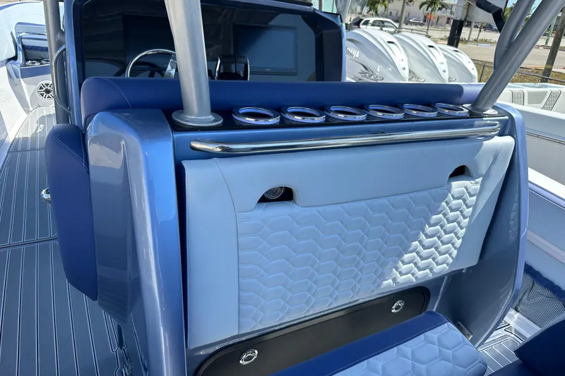 Slide: The Image of 2024 Nor-Tech 340 Sport Center Console interior with sleek blue and white design. - 10