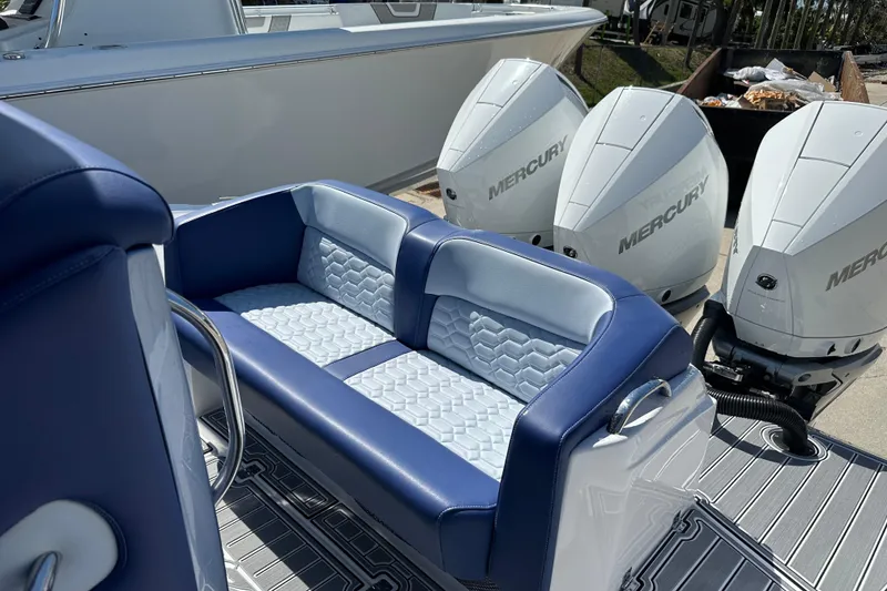 Slide: The Image of 2024 Nor-Tech 340 Sport Center Console with Mercury engines and luxurious seating. - 12