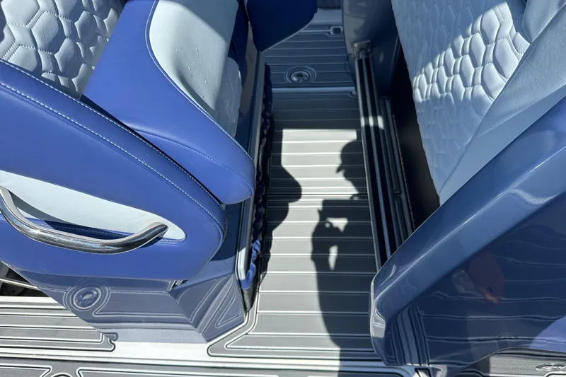 Slide: The Image of 2024 Nor-Tech 340 Sport Center Console interior with blue and white seating detail. - 7