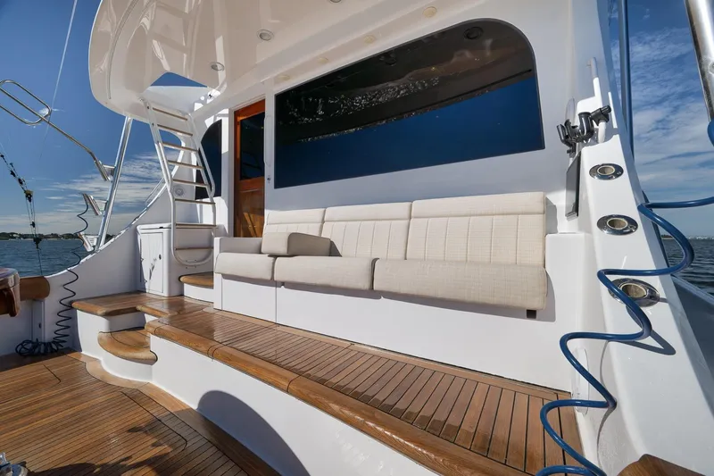 Slide: The Image of Luxurious 2015 Hatteras GT70 yacht deck with seating and ocean view. - 19