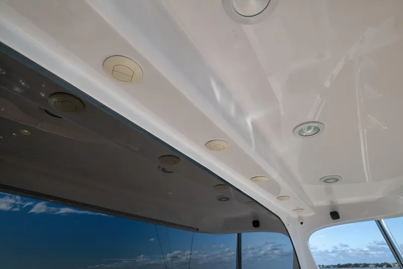 Slide: The Image of Open storage compartment on 2015 Hatteras GT70 yacht with wooden deck. - 24