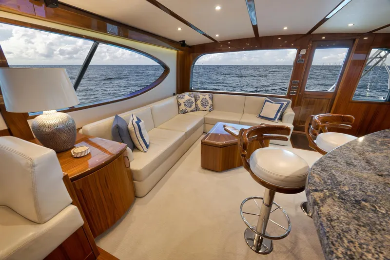 Slide: The Image of Luxurious interior of 2015 Hatteras GT70 yacht with elegant wood finishes and modern amenities. - 28