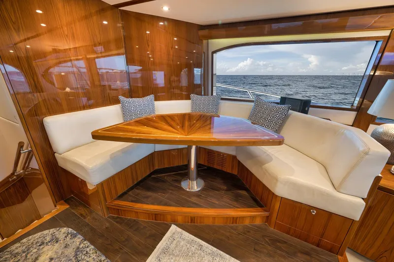 Slide: The Image of Luxurious interior of 2015 Hatteras GT70 yacht with ocean view and elegant seating area. - 30