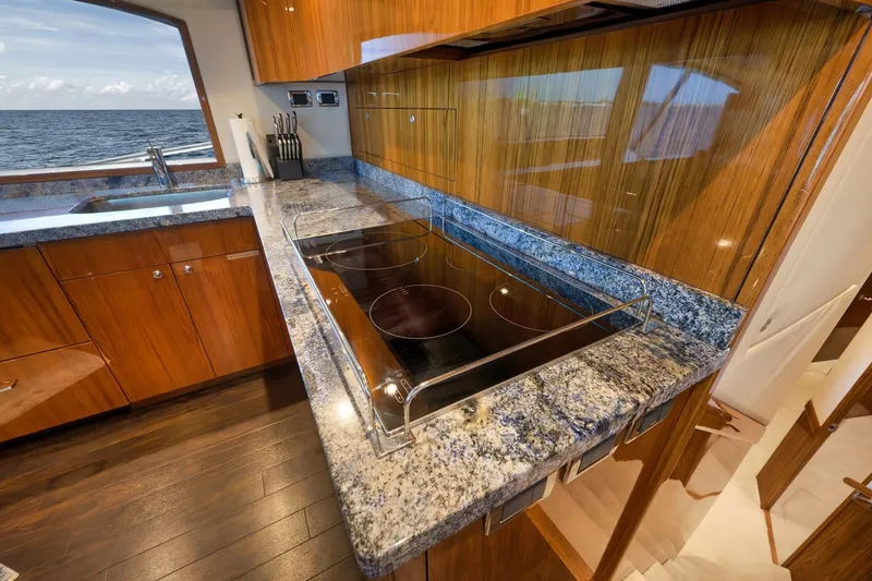 Slide: The Image of Luxurious kitchen interior of 2015 Hatteras GT70 yacht with ocean view. - 37