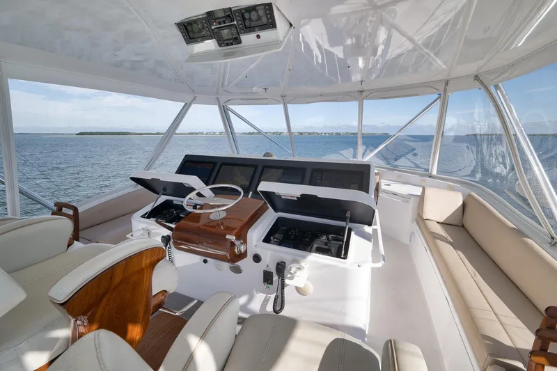 Slide: The Image of Luxurious cabin interior of 2015 Hatteras GT70 yacht with wood finish and patterned bedding. - 59