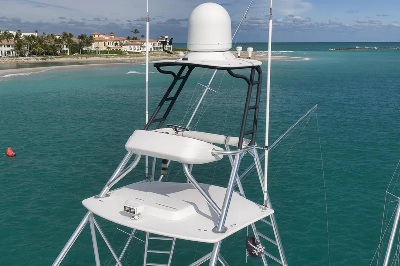 Slide: The Image of Flybridge of 2015 Hatteras GT70 yacht with captain chairs and ocean view. - 75