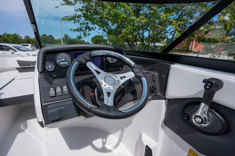 Slide: The Image of 2024 Monterey M-205 boat dashboard with steering wheel and control panel. - 11