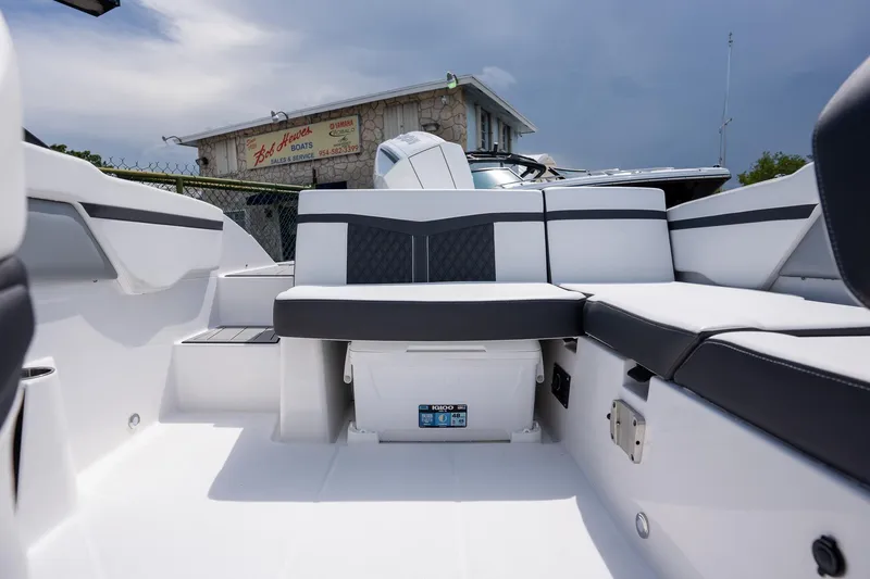 Slide: The Image of 2024 Monterey M-205 boat interior with sleek seating and storage compartment. - 8