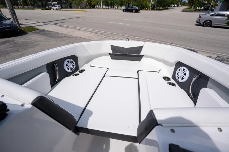 Slide: The Image of 2024 Monterey M-205 boat interior with white seating and built-in speakers. - 9