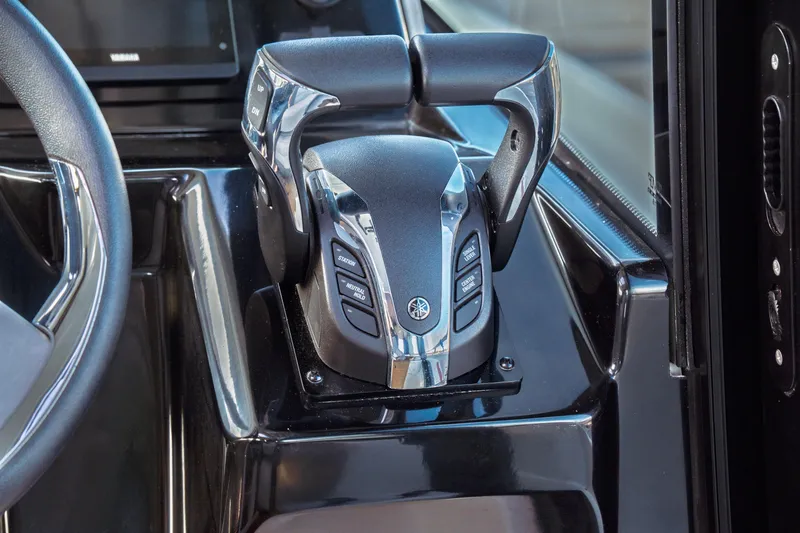 Slide: The Image of 2019 Jeanneau NC 1095 boat throttle controls with sleek design and modern features. - 28
