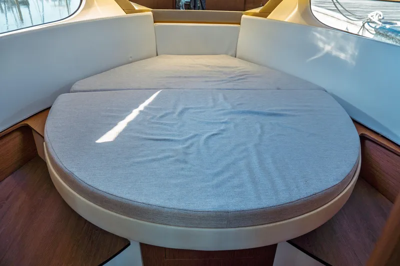 Slide: The Image of 2019 Jeanneau NC 1095 boat interior with spacious cushioned seating area. - 31