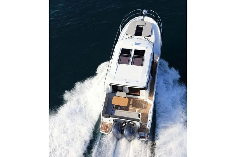 Slide: The Image of Manufacturer Provided Image: 2019 Jeanneau NC 1095 cruising on water with passengers. - 4
