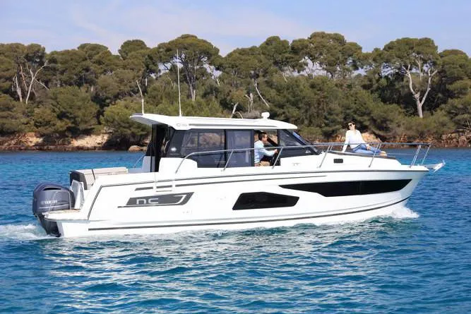 Slide: The Image of Manufacturer Provided Image: 2019 Jeanneau NC 1095 motorboat cruising on open water. - 5