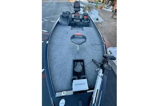 Slide: The Image of 2025 Tracker Savage 215 fishing boat with Garmin equipment and seating on deck. - 5