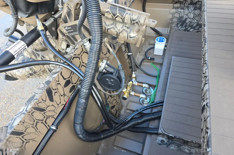 Slide: The Image of Interior view of a 2026 Pro-Drive 2060 boat, showcasing wiring and mechanical components. - 11