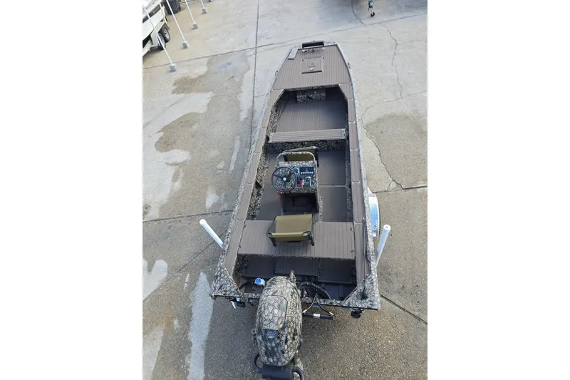 Slide: The Image of 2026 Pro-Drive 2060 boat with camouflage design, parked on concrete surface. - 6