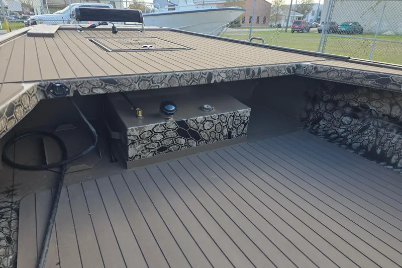 Slide: The Image of 2026 Pro-Drive 2060 boat interior with camouflage design and spacious deck. - 7