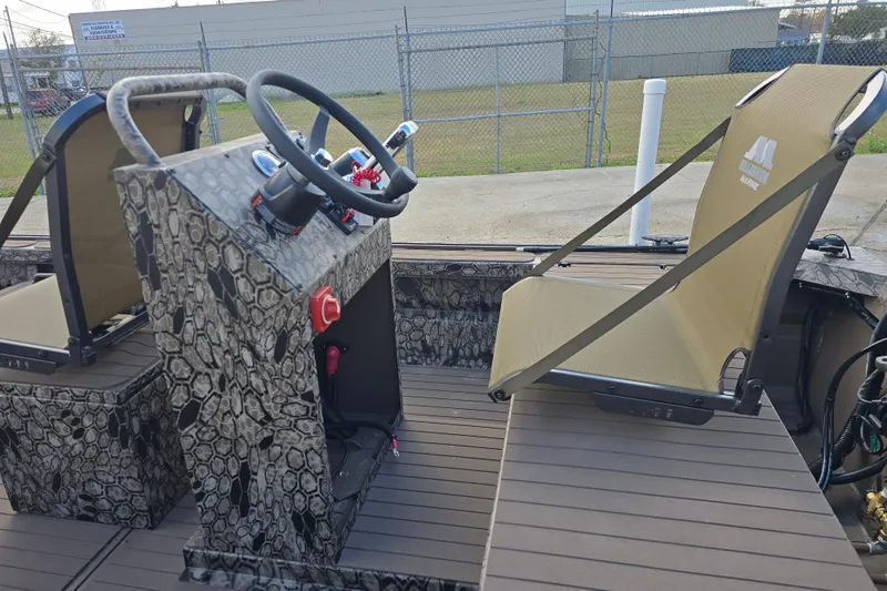 Slide: The Image of Interior of 2026 Pro-Drive 2060 boat with camouflage design and modern seating. - 9