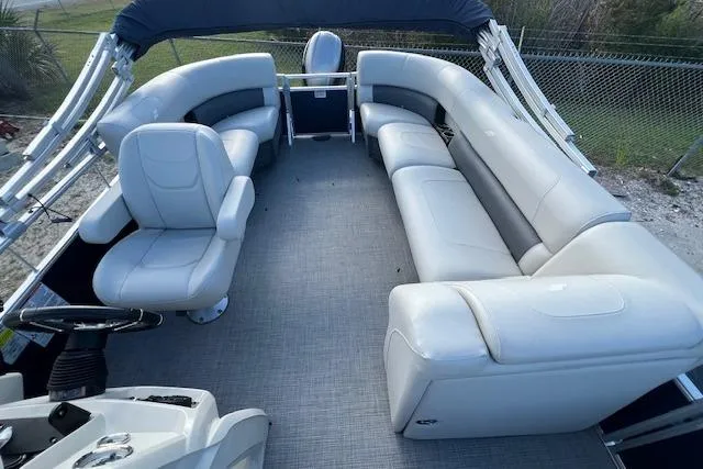 Slide: The Image of 2024 Starcraft LX 20 R pontoon boat interior with spacious seating and modern design. - 3
