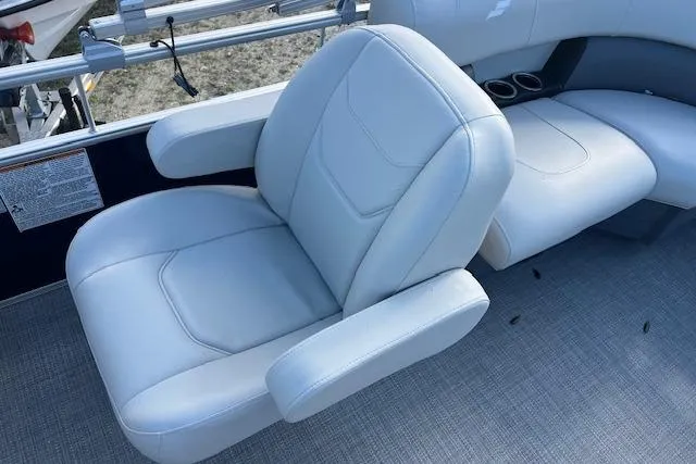 Slide: The Image of 2024 Starcraft LX 20 R boat interior with plush white seating and armrests. - 5