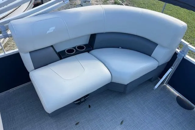 Slide: The Image of 2024 Starcraft LX 20 R boat seating with cup holders, featuring sleek gray upholstery. - 6