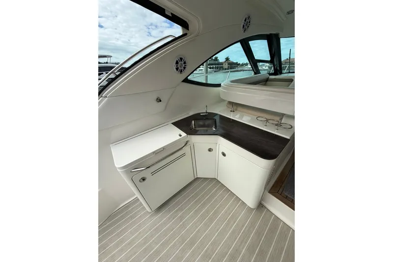 Slide: The Image of Interior view of 2014 Sea Ray 470 Sundancer yacht with kitchenette and sink. - 17