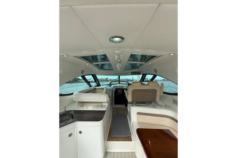 Slide: The Image of Interior of 2014 Sea Ray 470 Sundancer yacht with luxurious seating and panoramic windows. - 20