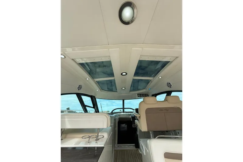Slide: The Image of Interior view of 2014 Sea Ray 470 Sundancer yacht with skylights and seating. - 22