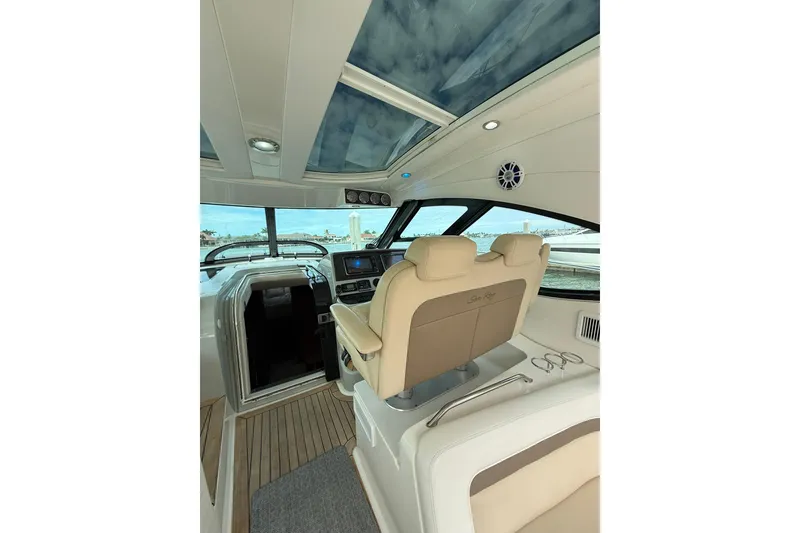 Slide: The Image of Interior view of 2014 Sea Ray 470 Sundancer yacht with helm and seating. - 25