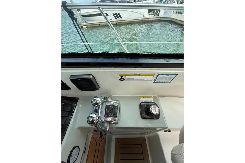Slide: The Image of Control panel of a 2014 Sea Ray 470 Sundancer yacht, overlooking marina. - 33
