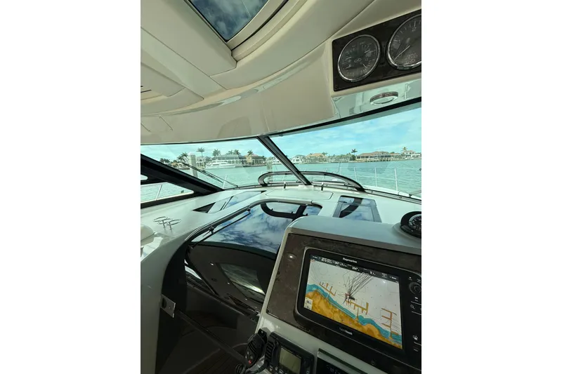Slide: The Image of Interior view of 2014 Sea Ray 470 Sundancer yacht cockpit with navigation system. - 36