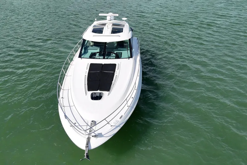 Slide: The Image of 2014 Sea Ray 470 Sundancer yacht cruising on open water. - 5