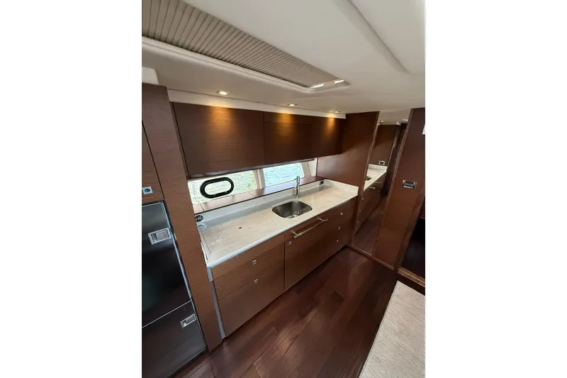 Slide: The Image of Luxurious interior of 2014 Sea Ray 470 Sundancer yacht with modern kitchen design. - 52
