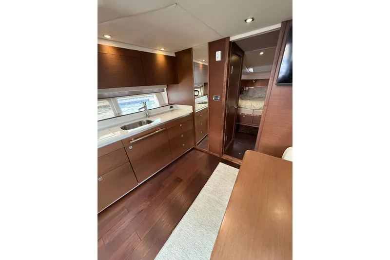 Slide: The Image of Luxurious interior of 2014 Sea Ray 470 Sundancer yacht with modern kitchen and cozy cabin. - 61
