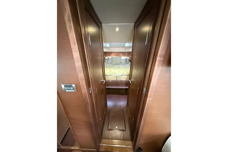 Slide: The Image of Interior hallway of 2014 Sea Ray 470 Sundancer yacht with wooden doors and cozy lighting. - 66