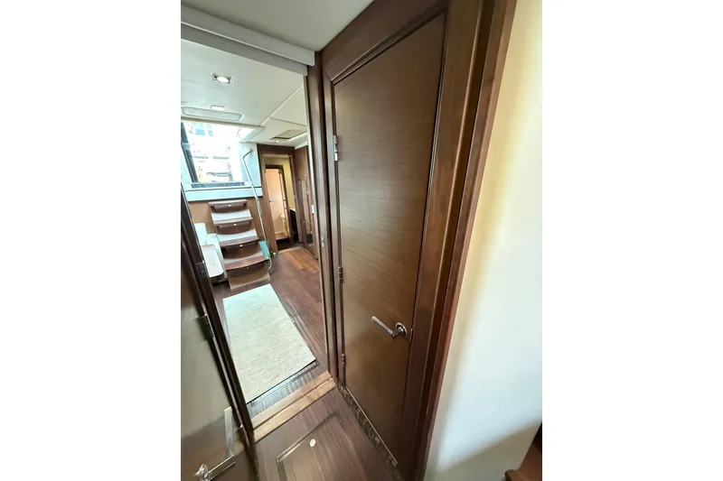 Slide: The Image of Interior hallway of 2014 Sea Ray 470 Sundancer yacht with wooden finishes. - 69