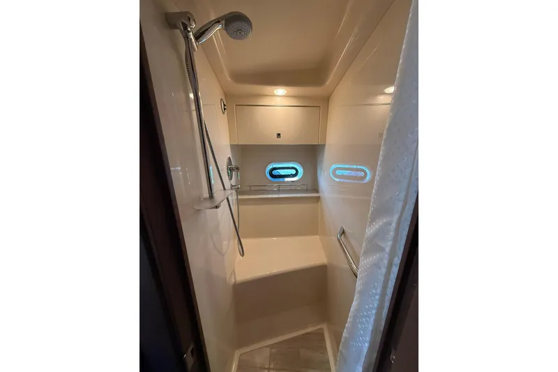 Slide: The Image of Shower area in 2014 Sea Ray 470 Sundancer yacht with modern fixtures and porthole window. - 72
