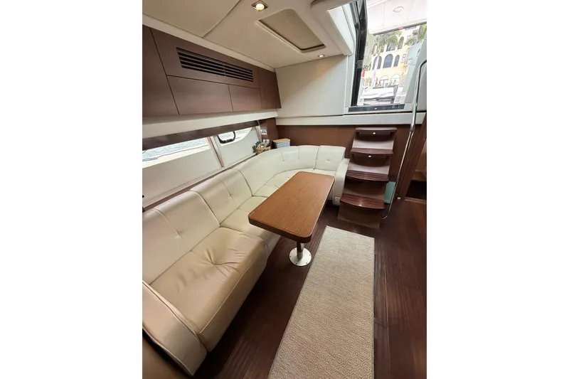 Slide: The Image of Luxurious interior of 2014 Sea Ray 470 Sundancer yacht with elegant seating and wooden accents. - 75