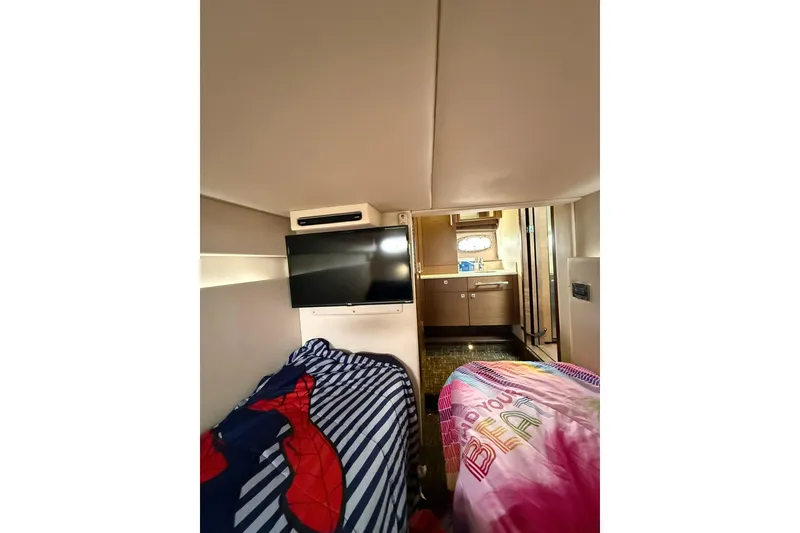 Slide: The Image of Interior of 2014 Sea Ray 470 Sundancer with twin beds and TV. - 80