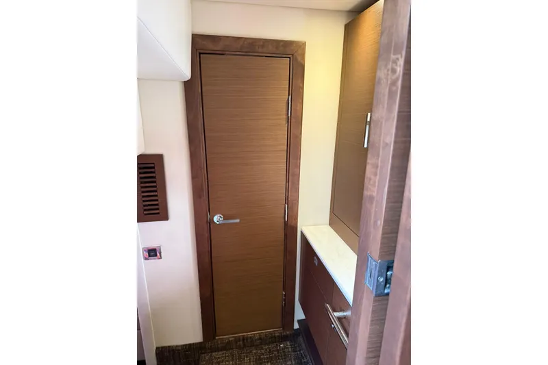 Slide: The Image of Interior view of 2014 Sea Ray 470 Sundancer yacht with wooden door and cabinetry. - 81